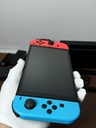 Nintendo Switch OLED Model HEG-001 Handheld Console - 64GB - Red & Blue Joycons cost