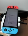 Nintendo Switch OLED Model HEG-001 Handheld Console - 64GB - Red & Blue Joycons price